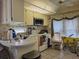 This spacious kitchen features a vintage interior and tiled flooring at 88 Bainbridge Dr # 88, Nokomis, FL 34275