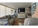Inviting living room with sofa, modern television, and plenty of natural light at 88 Bainbridge Dr # 88, Nokomis, FL 34275