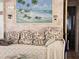 Cozy living room showcases a beach-themed painting and comfortable daybed at 88 Bainbridge Dr # 88, Nokomis, FL 34275