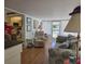 Cozy living room with a view into the kitchen, featuring comfortable seating at 88 Bainbridge Dr # 88, Nokomis, FL 34275
