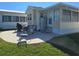 Exterior features a patio, chairs, grill, and landscaping at 88 Bainbridge Dr # 88, Nokomis, FL 34275