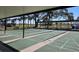 A look at the community shuffleboard courts, benches, and parking area at 88 Bainbridge Dr # 88, Nokomis, FL 34275