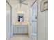 Bright bathroom featuring a large vanity with an updated faucet and hardware at 931 Olympia Rd, Venice, FL 34293