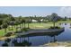 Lush golf course and pond showcasing beautifully manicured greens and waterfront scenery at 934 Wexford Blvd # 934, Venice, FL 34293