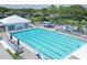 Large community pool with lap lanes and plenty of lounging chairs and tables at 934 Wexford Blvd # 934, Venice, FL 34293