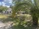 Charming single-Gathering home featuring a spacious yard and mature landscaping at 964 1St Dirt Rd, Venice, FL 34292
