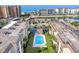 Aerial view of building and pool with ocean views at 995 Laguna Drive # 303, Venice, FL 34285