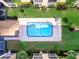 Aerial view of pool and manicured lawn at 995 Laguna Drive # 303, Venice, FL 34285