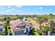 Aerial view of the home highlighting the community pond at 351 Carlino Dr, Nokomis, FL 34275