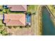 Aerial view of the backyard showing the screened in pool, patio, and water view at 351 Carlino Dr, Nokomis, FL 34275