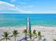 Scenic beach aerial view of a pier stretching into the Gulf of Mexico at 351 Carlino Dr, Nokomis, FL 34275