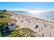 Beautiful beach with clear blue water and boardwalk with tropical vegetation, offering a stunning coastal experience at 351 Carlino Dr, Nokomis, FL 34275