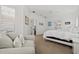 Bright bedroom offering a comfortable seating area and minimalist decor at 351 Carlino Dr, Nokomis, FL 34275
