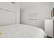 Bedroom with white comforter, full closet, and bright natural light at 351 Carlino Dr, Nokomis, FL 34275