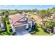 Aerial view of the home highlighting the community pond at 351 Carlino Dr, Nokomis, FL 34275