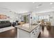 Bright living space featuring an open floorplan, granite countertops, and comfortable seating at 351 Carlino Dr, Nokomis, FL 34275
