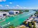 Aerial view of marina with boat storage, docks, and a waterfront restaurant offering picturesque waterfront lifestyle at 351 Carlino Dr, Nokomis, FL 34275
