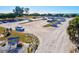 Expansive parking area at North Jetty Park filled with cars, with glimpses of beach and ocean in the background at 351 Carlino Dr, Nokomis, FL 34275
