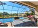Screened-in pool area with a beautiful view of the water and nature preserve at 351 Carlino Dr, Nokomis, FL 34275