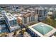 Aerial view of buildings and rooftop pool, offering a glimpse of community amenities and the city skyline at 100 Central Ave # D509, Sarasota, FL 34236