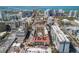 Stunning aerial view of the community showcasing the building, pool, surrounding cityscape, and waterways at 100 Central Ave # D509, Sarasota, FL 34236