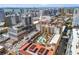 Aerial view showcasing the building's rooftop amenities, including a pool, and the city skyline at 100 Central Ave # D509, Sarasota, FL 34236