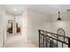 Hallway with white walls and an iron railing at 100 Central Ave # D509, Sarasota, FL 34236