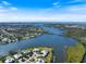 Aerial view of waterfront properties with boat docks and gulf access, showcasing waterfront living at 1358 Ewing St, Nokomis, FL 34275