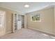 Bright bedroom featuring an organized closet with white shelving, drawers, and a sunlit window at 1358 Ewing St, Nokomis, FL 34275