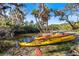 Waterside view showcasing kayaks, perfect for outdoor adventures and enjoying serene water access at 1358 Ewing St, Nokomis, FL 34275