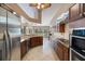 Kitchen featuring granite countertops, stainless steel appliances, and wood cabinetry at 1358 Ewing St, Nokomis, FL 34275