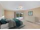 Carpeted main bedroom features a walk-out to the pool, ceiling fan, and a chest of drawers at 1358 Ewing St, Nokomis, FL 34275