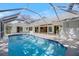 Inviting screened-in pool perfect for relaxation and recreation at 1358 Ewing St, Nokomis, FL 34275