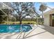 Inviting screened-in pool, perfect for year-round enjoyment with serene outdoor views and a relaxing atmosphere at 1358 Ewing St, Nokomis, FL 34275