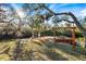 Scenic waterfront with kayaks and charming swing, creating a perfect spot for relaxation and outdoor adventures at 1358 Ewing St, Nokomis, FL 34275