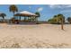 Beach volleyball court with net and shelter pavilion ready for a friendly game at 17 Brentwood Ln, Englewood, FL 34223