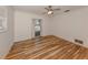 Bedroom with hardwood floors and sliding glass doors leading to the pool at 17 Brentwood Ln, Englewood, FL 34223