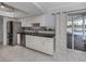 Kitchen featuring stainless steel appliances, and white cabinetry at 17 Brentwood Ln, Englewood, FL 34223