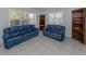 Living room featuring tile flooring and bright windows at 17 Brentwood Ln, Englewood, FL 34223