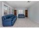 Open-concept living room featuring tile flooring and bright windows at 17 Brentwood Ln, Englewood, FL 34223