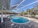 Screened-in pool area featuring an in-ground pool and brick paver flooring at 17 Brentwood Ln, Englewood, FL 34223