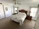 Cozy bedroom with a plush bed and soft lighting from bedside lamps at 210 Schooner St, North Port, FL 34287