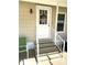 Welcoming front entrance featuring stairs leading up to a white door with decorative wreath at 210 Schooner St, North Port, FL 34287