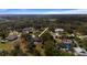 An aerial view showcases mature trees throughout the community and illustrates the proximity of homes to each other at 2537 Northway Dr, Venice, FL 34292