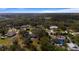 Aerial view showcasing community homes nestled amongst mature trees in a lush landscape, offering a sense of community and nature at 2537 Northway Dr, Venice, FL 34292