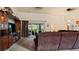 Comfortable living room featuring vaulted ceilings, a ceiling fan, and a sliding glass door to the lanai at 2537 Northway Dr, Venice, FL 34292