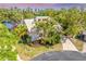 Aerial view of a house with a beautiful yard and mature landscaping at 3 Inlets Blvd # 3, Nokomis, FL 34275