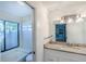 Bathroom with a sink, a mirror, and a shower at 3 Inlets Blvd # 3, Nokomis, FL 34275