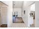 Bright and airy hallway showcasing tile flooring, leading to the home's interior at 3 Inlets Blvd # 3, Nokomis, FL 34275