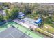 Aerial view of the shuffleboard area near the tennis courts with covered seating areas at 3 Inlets Blvd # 3, Nokomis, FL 34275